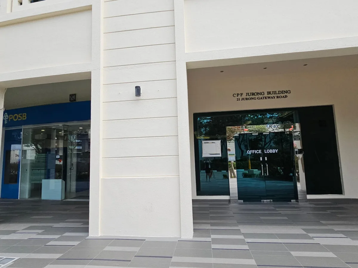 The office lobby entrance of CPF Jurong Building at 21 Jurong Gateway Road, beside the POSB branch